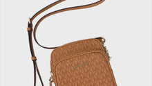 Load and play video in Gallery viewer, MICHAEL KORS JET SET TRAVEL MEDIUM SIGNATURE LOGO SHOULDER BAG - 01501